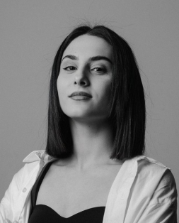 Professional headshot of Meline Mamyan, a young woman with dark hair, looking directly at the camera with a confident expression.