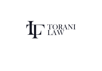 Torani Law firm logo featuring an intertwined 'TL' monogram and the text 'TORANI LAW' in dark blue.
